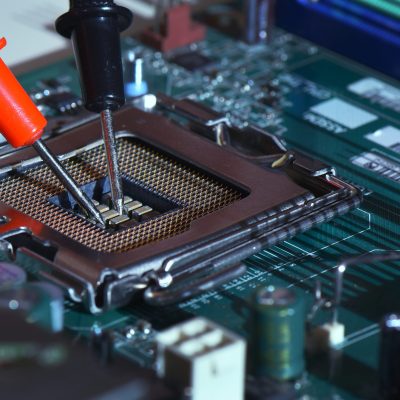 Close up needle tipped tip multimeter checking service  repairing cpu computer. Repairing and service concept