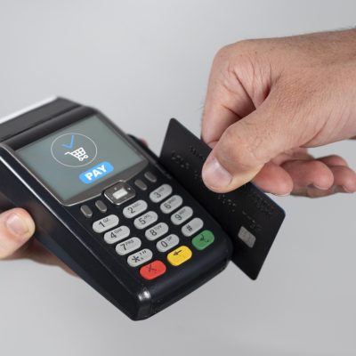 man-using-his-credit-card-pay-product